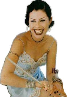 an image of a woman that is smiling and holding a baseball bat in her hand