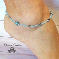 beaded ankle bracelet, beaded accessories, summer jewelry, beach wear, mothers day, gift, flower anklet, dainty, ankle bracelet, handmade jewelry. I made this dainty ankle bracelet with tiny glass seed beads, and a toggle closure. Its perfect to wear with your summer outfits. The spacer beads are Summer Jewelry Beach, Beaded Ankle Bracelets, Beaded Ankle, Jewelry Beach, Gift Flower, Ankle Bracelet, Bracelet Beaded, Beaded Accessories, Bracelet Handmade