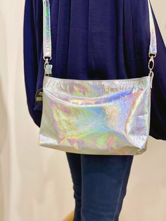 Italian Holographic leather Crossbody bag - Smaller size HANDMADE in Australia This is a bit smaller than the regular crossbody listed here https://etsy.me/3OgeMif *  see how the leather can be warm or cooler in different light?  Strong smooth leather *  3 inside slip pockets, leather edged and riveted *  1 outside zipper pocket *  Strong easy zip closure *  Quality strong hardware (silver shown) *  Riveted adjustable, removable strap - Choose Black or holo leather Strap Size: W 28.5cm x H 22.5c Iridescent Bag With Zipper Closure For Everyday Use, Iridescent Bags With Zipper Closure For Everyday Use, Everyday Iridescent Bag With Zipper Closure, Iridescent Everyday Bags With Zipper Closure, Trendy Iridescent Bags, Trendy Metallic Crossbody Bag, Metallic Rectangular Bag With Zipper Closure, Rectangular Metallic Bag With Zipper Closure, Metallic Rectangular Bags With Zipper Closure