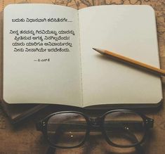 an open book with a pen and glasses on it