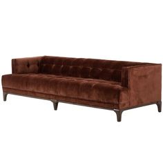 a brown velvet couch with wooden legs