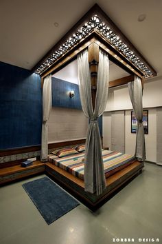 a bed room with a neatly made bed and curtains