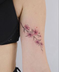 a woman's arm with flowers on it