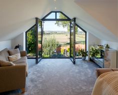 a living room with an open roof window