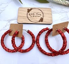 Check out these cute glitter hoops! Made with glitter and resin on a stainless steel hoop.  Hoops are available in 30, 40, or 50mm. Thanks for your business! W&E Farms Earring Hoops, Glitter Earrings, Red Glitter, Jewelry Earrings Hoops, Wedding Basket, Beauty Book, Accessory Gift, Hoop Earrings, Jewelry Earrings