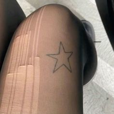 a person with a star tattoo on their leg