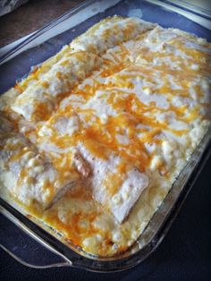 a casserole dish with cheese and meat in it