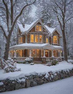 a large house with lots of windows and snow on the ground in front of it