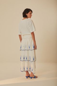 Discover the charm of the Off-White Sea Of Fish Embroidered Midi Skirt, crafted with detailed embroidery that tells a story of oceanic delight. This whimsical piece features a delicate sea-life motif, dancing along the hem in vibrant blue hues. The softly gathered waist creates a flattering silhouette, while the crafted material speaks of a thoughtful approach to fashion. Add an element of playful sophistication to your wardrobe with this unique and thoughtful creation.Composition 55% LINEN 45% Detailed Embroidery, White Sea, Blue Skirt, Farm Rio, Vibrant Blue, Blue Hues, Sea Life, White Linen, Midi Skirt