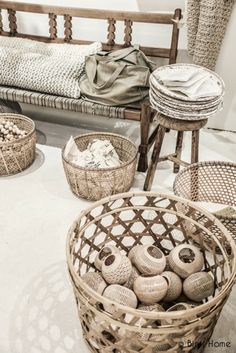 baskets and stools are sitting on the floor