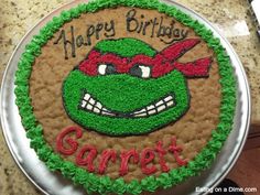 a teenage mutant birthday cake with the name gamjet on it's face