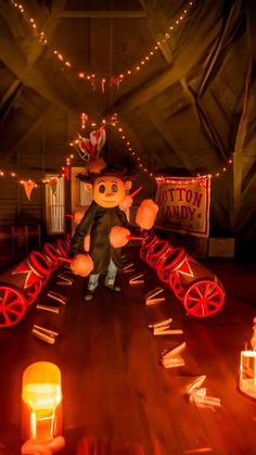 a large stuffed animal sitting on top of a wooden floor next to candles and signs