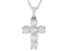 Moissanite Fire® .78ctw diamond equivalent weight round, rhodium over 10k white gold cross pendant with 18 inch rope chain. Measures 3/4" L x 7/16" W and has a spring ring clasp. Actual moissanite weight is .66ctw. Comes with certificate of authenticity. Diamond Round Cross Necklace For Anniversary, Anniversary Cross Necklace With Diamond Accents, White Vvs Clarity Cross Necklace For Anniversary, White Gold Cross Pendant, Gold Cross Pendant, Gold Cross, Rope Chain, Spring Rings, Cross Pendant