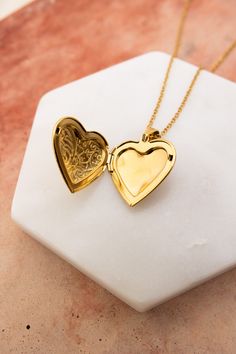 The Love Me Heart Heart Locket Necklace is the perfect way to show someone you care. Available in gold and silver, this cute necklace is a perfect gift for any occasion. Spread love and happiness with this adorable accessory. #lovemyleto #completeyourlook 100% Stainless Steel Imported Elegant Heart Locket Necklace With Adjustable Chain, Heart Locket Necklace For Valentine's Day Anniversary, Rose Gold Heart Pendant Locket Necklaces, Valentine's Day Heart Charm Locket Necklace For Anniversary, Anniversary Heart Pendant Locket Necklace, Anniversary Heart Locket Necklace, Double Heart Charm Locket Necklace For Wedding, Heart Locket Necklace For Valentine's Day, Double Heart Locket Necklace With Heart Charm For Wedding