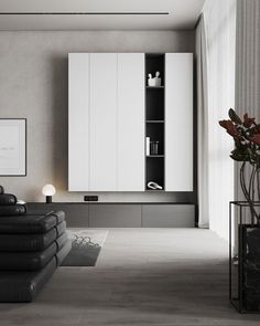 a modern living room with black and white furniture