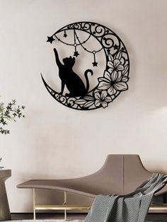 a cat is sitting on the moon with stars in it's back wall decal