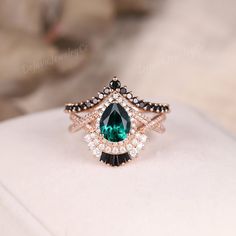 Unique Pear Cut Emerald Engagement Ring Set Black Onyx Wedding Ring Set Women Solid Rose Gold Bridal Set May Birthstone Jewelry Gift For Her ✦ Handmade, high-quality item ✦ Material: SOLID 10K/14K/18K GOLD ( can be made in yellow/white/rose gold ) ✦Engagement ring ✦ Center stone: Lab emerald ✦ Size/Weight: 6*8mm ✦ Color: Green ✦ Cut: Pear Shaped ✦ Side stones: Moissanite ✦ Weight: About 0.51ct  ✦ Color: DEF Color ✦ Or Side stones Diamond: 0.51ct ✦ Band Width: Around 1.6mm ✦Wedding band ✦ Side st Emerald And Black Diamond Ring, Green And Black Engagement Ring, Elegant Black Jewelry For Marriage, Elegant Black Jewelry For Wedding, Black Wedding Jewelry, Onyx Wedding Ring, 6mm Wedding Band, Rose Gold Bridal Set, Emerald Engagement Ring Set