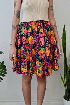 Adorable 60s/70s Handmade Floral Circle Skirt. Elastic Waistband. Unlined. Zipper in Back With Double Hook & Eye Closure.  No Content Label  No Size Tag  Great/Good Vintage Condition - Homemade ~ Imperfections Throughout All Measurements Taken Flat Waist-10"-12"  Hips-free  Length-22" All Sales Are Final. We have taken the time to note all size measurements and the condition of each piece so please look over all the information of the garment you are considering purchasing. Please note that all Retro Pleated Spring Skirt, Retro Full Mini Skirt For Spring, Spring Vintage Skirted Bottoms, Retro Pleated Mini Skirt For Spring, Spring Retro Lined Skirt, Retro Flowy Skirt For Spring, Retro Flared Skirt For Spring, Retro Pleated Mini Skirt, Retro Stretch Mini Skirt For Summer