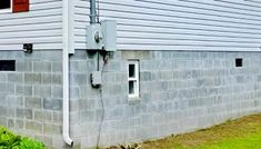 an electrical box attached to the side of a house