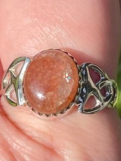 Celtic Sunstone Ring Luck Sunstone is the stone of luck and good fortune. It clears and energizes the chakras. This stone heightens intuition and allows your real self to shine through. It removes fear and alleviates stress. Sunstone encourages independence and originality. This stone is especially helpful to those who have a difficult time saying “No” to others. It facilitates self-empowerment and independence. Sunstone acts as an antidepressant and increases self-worth and confidence. This sto Spiritual Silver Crystal Ring, Adjustable Spiritual Crystal Ring With Round Stone, Silver Crystal Ring For Healing, Silver Crystal Ring With Birthstone For Healing, Spiritual Moonstone Healing Ring, Spiritual Moonstone Ring For Healing, Spiritual Healing Rings With Natural Stones, Spiritual Moonstone Birthstone Ring For Healing, Sterling Silver Crystal Ring For Healing