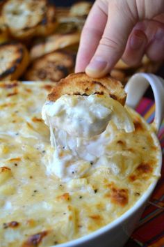 a spoon full of cheesy bread and cheese