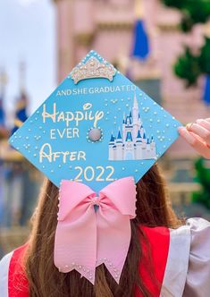 pearls, a big pink bow, and a crown! yesss the perfect graduation cap idea for people who can't get enough of all things Disney Princess Graduation Cap