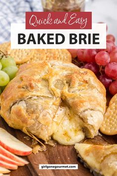 baked brie on a cutting board with grapes, apples and crackers next to it