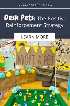 a desk with toys and a sign that says, desk pets the positive reinforment strategy