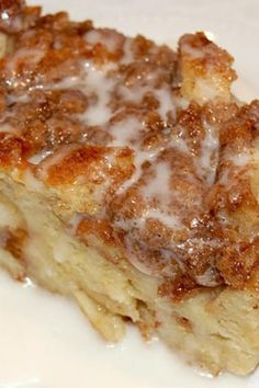 a piece of cake sitting on top of a white plate covered in frosted toppings