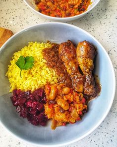 two bowls filled with different types of food on top of a white countertop next to each other