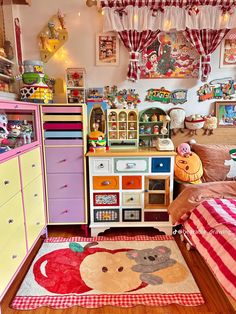 a child's bedroom with lots of toys on the floor