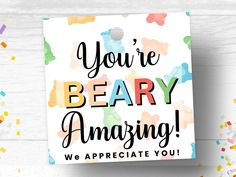 a card with the words you're beary amazing on it and confetti sprinkles around it