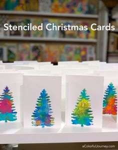 three christmas cards with trees on them and the words stenciled christmas cards written below