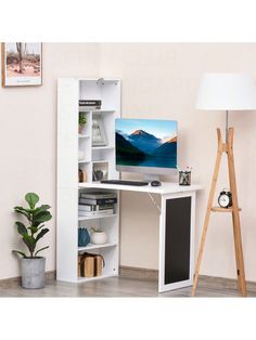 a white computer desk with a monitor and keyboard