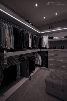 a walk in closet filled with lots of clothes