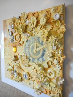 a clock made out of buttons and other things