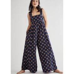 Nwt Free People Size X-Small Floral Printed One-Piece Wide Leg Jumpsuit In Navy And Orange And Yellow Combo. Material: 100% Cotton Arm Pit To Arm Pit 16 Inches Across Inseam 26.5 Length 53 Inches *Inked Marked Line Through Label To Avoid In-Store Return. Cotton Jumpsuits And Rompers With Floral Print For Loungewear, Cotton Floral Print Jumpsuits And Rompers For Loungewear, Blue Floral Print Sleeveless Jumpsuits And Rompers, Blue Printed Cotton Jumpsuits And Rompers, Printed Blue Cotton Jumpsuit And Romper, Blue Floral Print Casual Jumpsuits And Rompers, Casual Orange Jumpsuits And Rompers With Floral Print, Casual Orange Jumpsuit With Floral Print, Casual Blue Printed Jumpsuits And Rompers