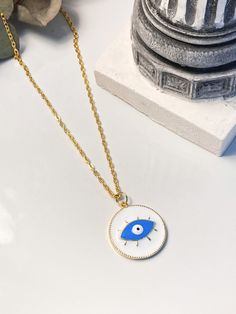 White evil eye necklace, round-shaped, stainless steel gold colour. Charm necklace for summer:) White Gold Plated Round Charm Necklace, White Round Gold Plated Charm Necklace, White Evil Eye Round Pendant Necklace, Gold Plated Evil Eye Round Necklaces, White Round Pendant Necklace With Evil Eye, Gold Plated Evil Eye Round Necklace, Gold Plated Round Evil Eye Necklace, Yellow Gold Evil Eye Charm Necklace, White Evil Eye