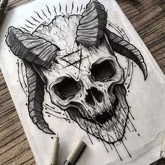 a drawing of a skull with horns on it