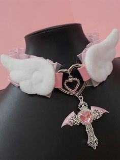 Elevate your Kawaii fashion game with our rhinestoned cross pendant blue/pink Jirai Kei angel wings PU choker. This stunning choker features a delicate PU leather band adorned with a rhinestoned cross pendant in a choice of blue or pink, perfectly capturing the ethereal essence of Jirai Kei style. The angel wings design adds a touch of whimsy and fantasy, making it a must-have accessory for any Kawaii wardrobe.  Please note that this product includes the choker only. Pastel Goth Jewelry, Cutecore Accessories, Chokers Aesthetic, Angelic Fashion, Cute Accessories Kawaii, Kawaii Wardrobe, Yami Kawaii Fashion, Cute Angel Wings, Pastel Goth Choker