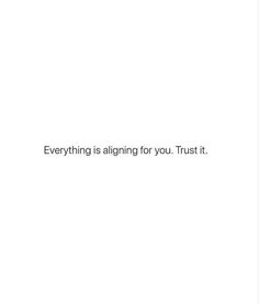 a white wall with the words everything is aligning for you trust it