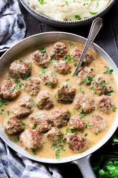 meatballs and mashed potatoes in a skillet