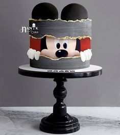 a mickey mouse cake on top of a table