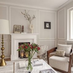 a living room filled with furniture and a fire place