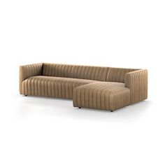 a beige couch and ottoman sitting on top of a white floor next to each other