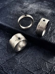 Statement roughness. Raw, pure and edgy surfaces with a strong and grunge look & feel. The handcrafted process make every piece unique, no ring will have the same texture. Forged with sand and fire, your ring will reflect your unique souls. A black zirconia stone is encrusted on the ring as symbol of strength. Dare to wear it, dare to be you.MATERIALS:Textured, oxidized and heavy brushed 925 sterling silver .Black cubic zirconia stone.Each piece is made and finished by hand, for this reason ever Techwear Fashion, Edgy Jewelry, Black Texture, Iron Ring, Symbols Of Strength, Sand Casting, Symbol Of Strength, The One Show, Grunge Look