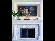 a fireplace with a painting on the mantle