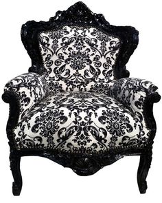 an ornate chair with black and white fabric