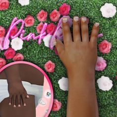 a woman's hands with manicured nails next to a pink and white flowered background