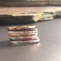 Earthy, Rustic thick set of stacking rings consisting of hammered mixed Metal and textured skinny bands. You will receive all of the rings pictured with your order: 2 skinny silver bands, 1 silver bead band, 2 14k gold filled bands, and 2 torch patinated copper bands. This is my favorite stacking ring set. You can wear them all together, or wear just a few and add in a gemstone stacker...the possibilities are endless. Please note that this set contains 2 copper (unsealed) rings. It is common for Memorial Crafts, Diamond Wedding Bands Stackable, Modern Silver Ring, Gold Stacking Rings, Rose Gold Morganite Ring, Mixed Metal Rings, Stackable Diamond Rings, Interlocking Ring, Stackable Rings Silver